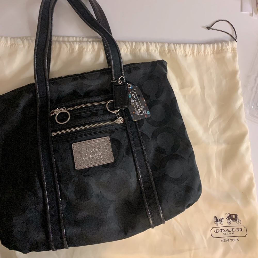 Black Coach bag with signature artwork